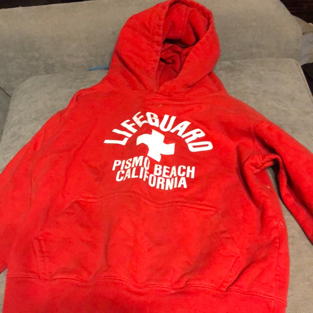 Red piano beach life guard sweater